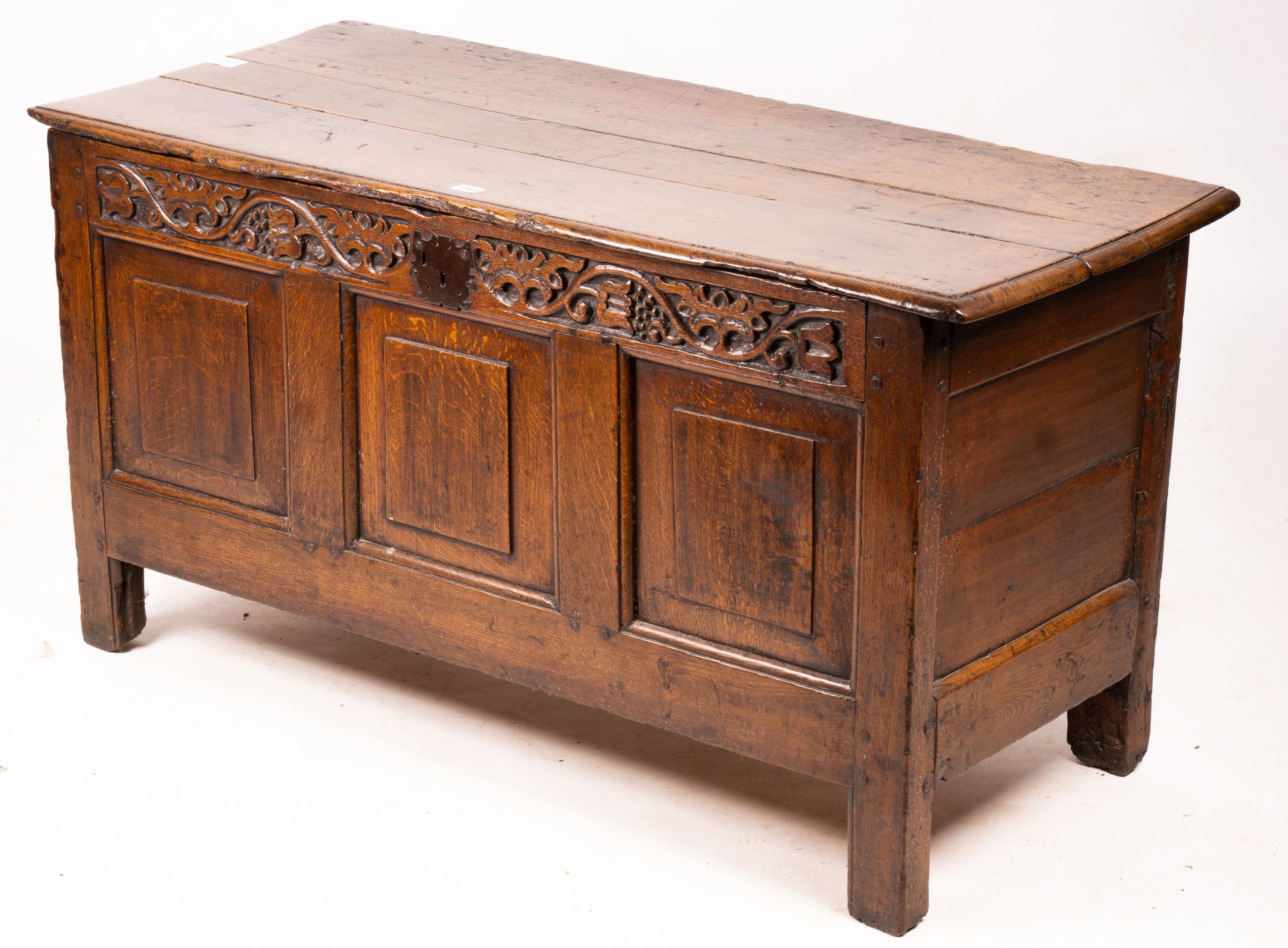 A 17th / 18th century carved oak coffer, length 132cm, depth 53cm, height 64cm